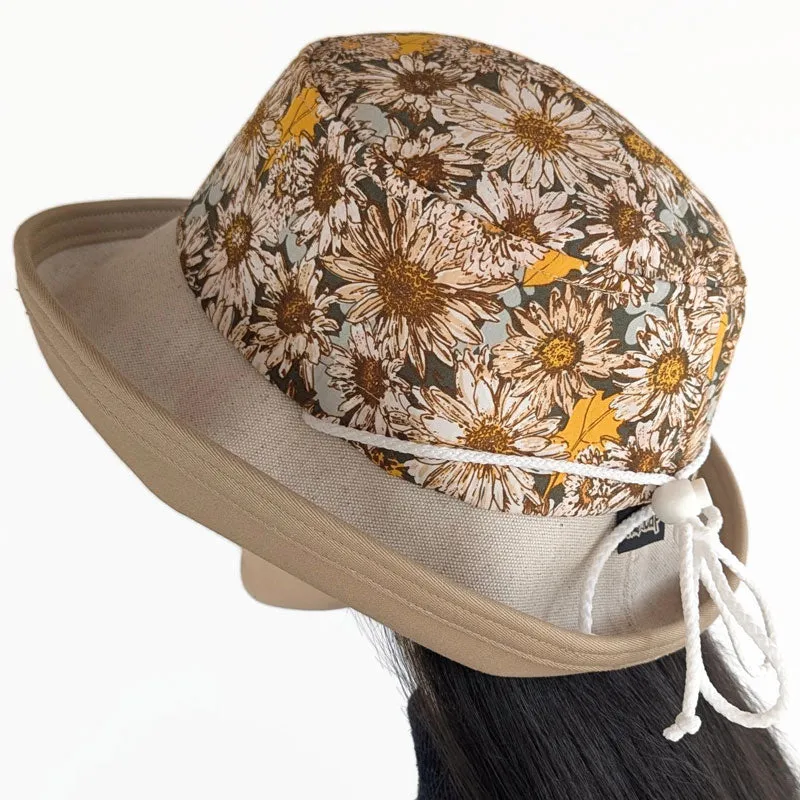 Sunblocker UV summer hat with large wide brim featuring sunflowers print in earth tones, adjustable fit