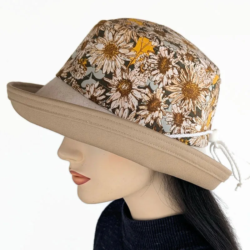Sunblocker UV summer hat with large wide brim featuring sunflowers print in earth tones, adjustable fit
