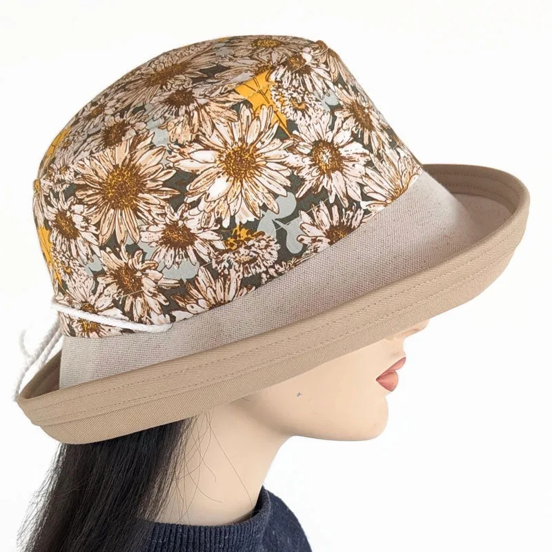 Sunblocker UV summer hat with large wide brim featuring sunflowers print in earth tones, adjustable fit