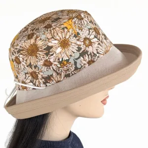 Sunblocker UV summer hat with large wide brim featuring sunflowers print in earth tones, adjustable fit